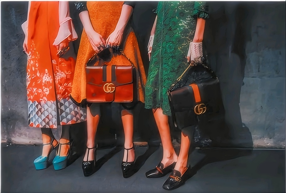 Close - up of three women's outfits and Gucci handbags with GG logo