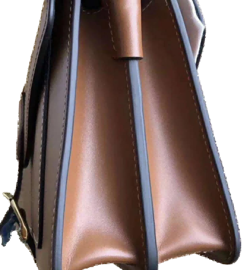 Luxury Bag Craftsmanship-Side view of a structured leather bag highlighting smooth leather and clean stitching lines.