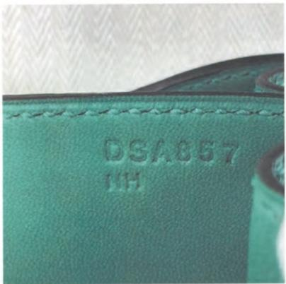 Hermès craft stamp showing "DSA857" – internal code for production tracking.