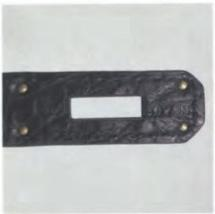 Hermès leather stamp – faint but detailed impression for craft identification.
