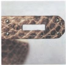 Close-up of Hermès internal stamp – minimal but precise craftsmanship marking.