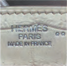 Hermès Niloticus crocodile leather with "HERMES PARIS MADE IN FRANCE" stamp – exotic leather authentication.