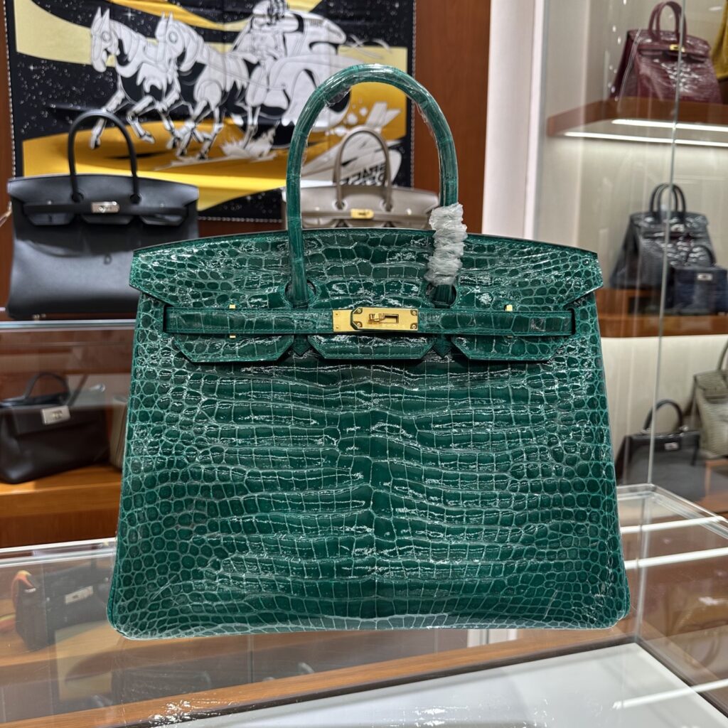 Macro view of the 18-degree saddle stitch on the best replica Hermes Birkin 35 Porosus, showcasing true handmade replica Hermes craftsmanship by Reinaluxe.