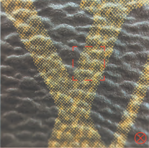 Fake Louis Vuitton monogram canvas 'LV' motif with incorrect dot pattern, marked with red cross as authentication fail