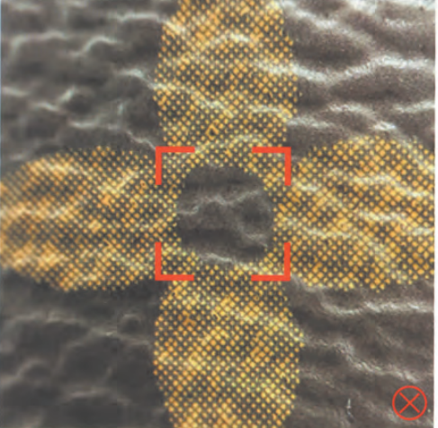 Fake Louis Vuitton monogram canvas flower motif with incorrect dot pattern, marked with red cross as authentication fail