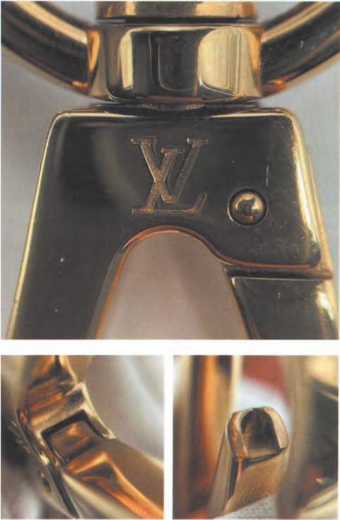 Authentic Louis Vuitton lock clasp hardware: crisp 'LV' engraving and polished screw finish