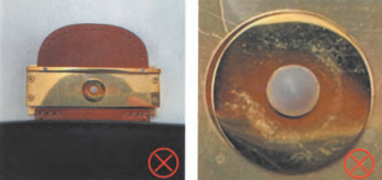 Fake Louis Vuitton lock clasp snap button with poor craftsmanship, marked with red cross as authentication fail