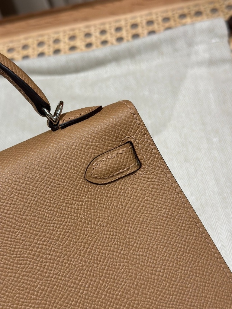 Close-up flaw check of Hermès Mini Kelly II Epsom Chai replica stitching