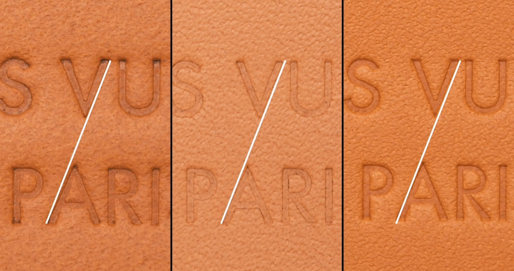 Close-up comparison of three Louis Vuitton interior leather tag stamps with diagonal analysis lines demonstrating that the pointed angles of "V" and "A" protrude slightly higher, with a straight line connecting the right side of "V" and left side of "A".