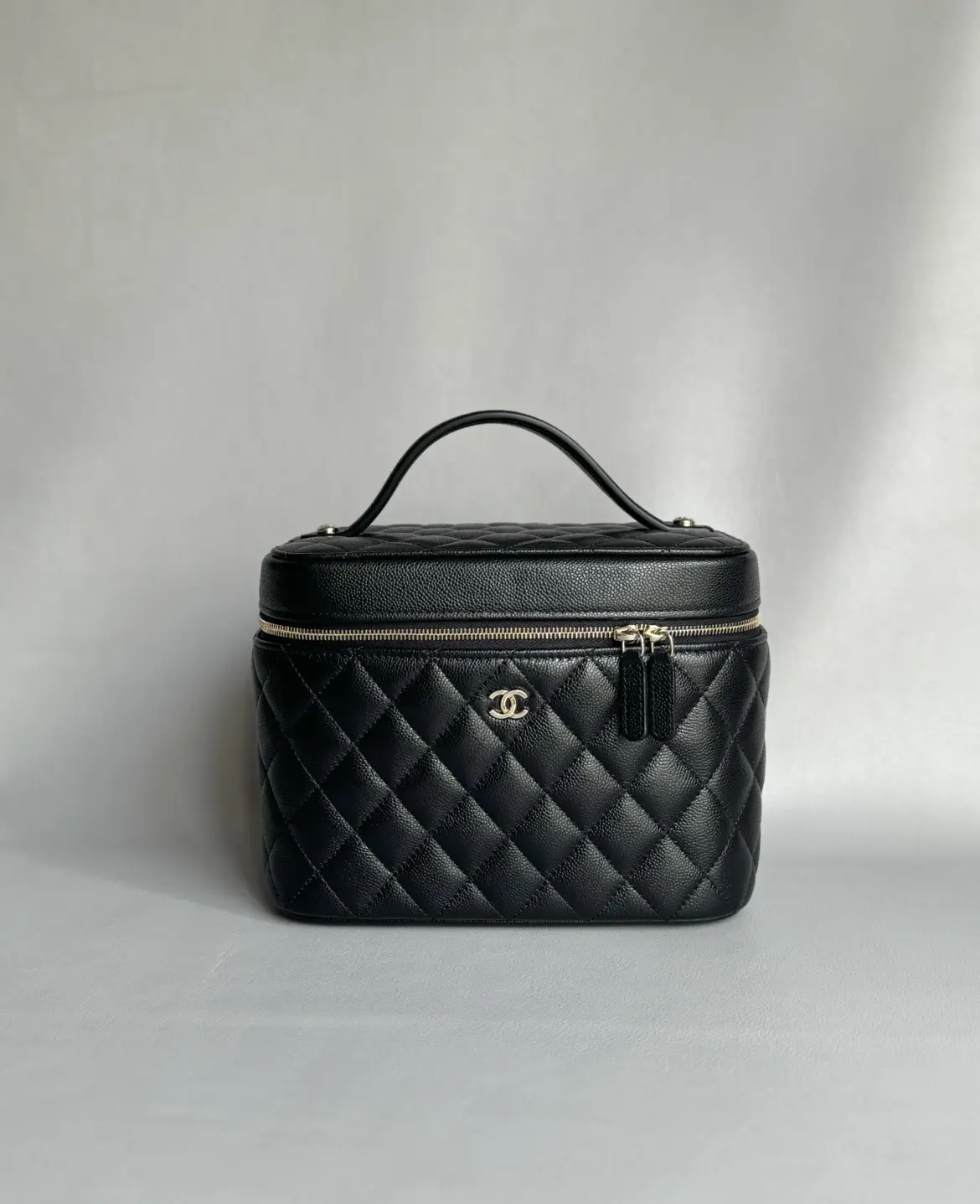 Chanel vanity case replica in black caviar with gold-tone hardware, front view