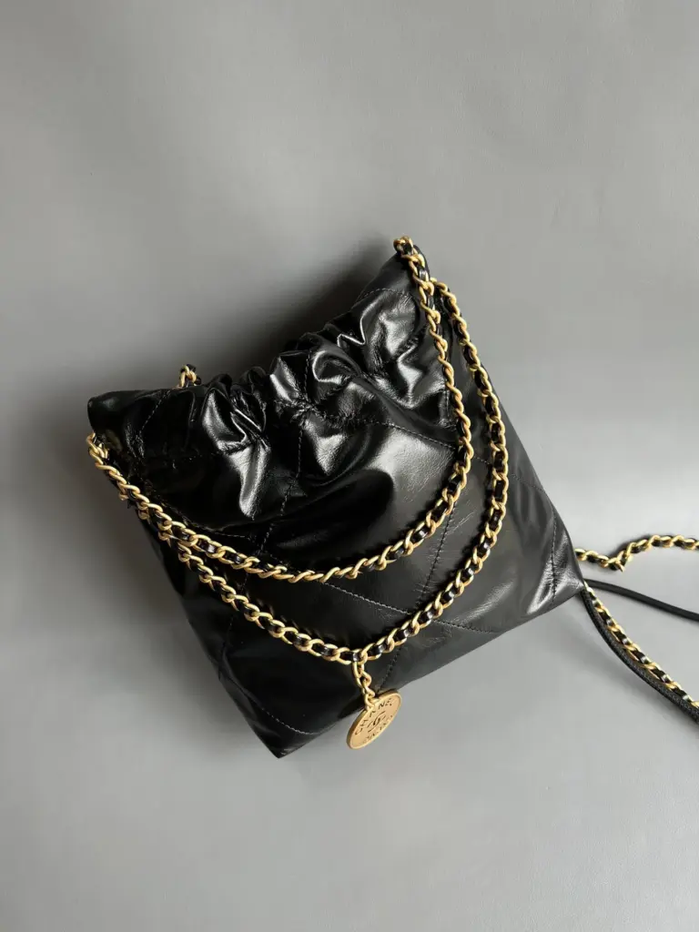 Rear view of the black Chanel 22 Mini-style bag
