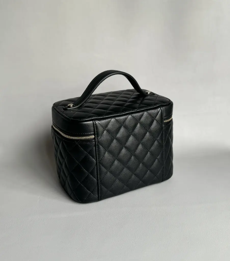 Rear and side view of the black quilted vanity case