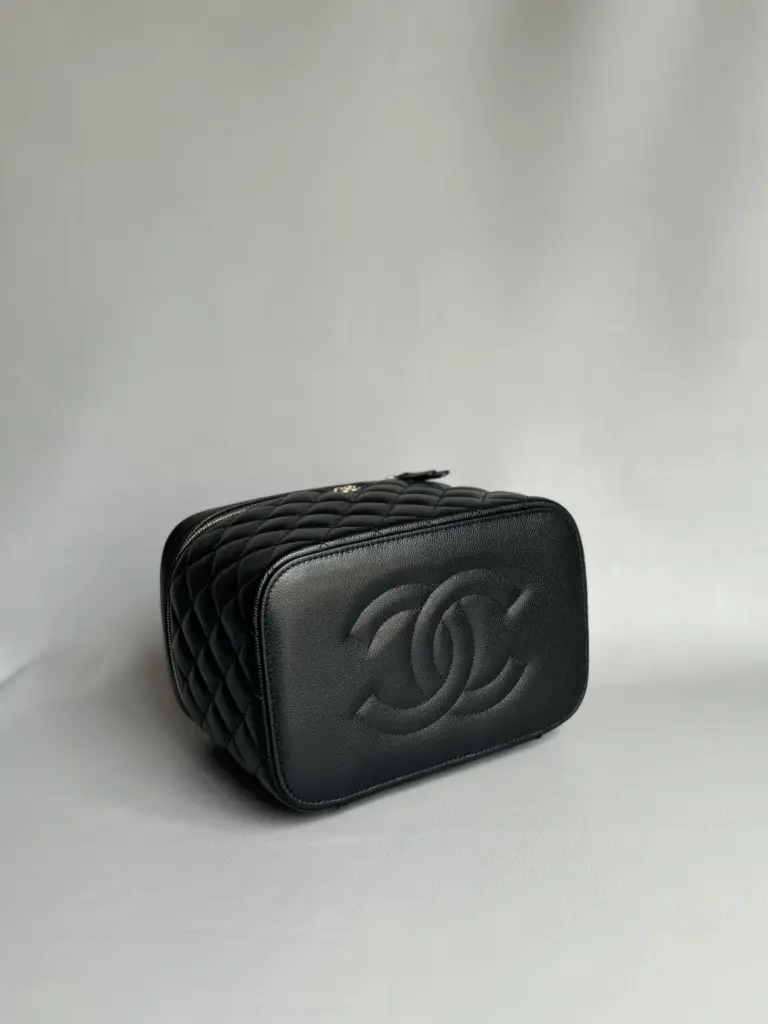 Base of the black caviar vanity case with an embossed double-C motif