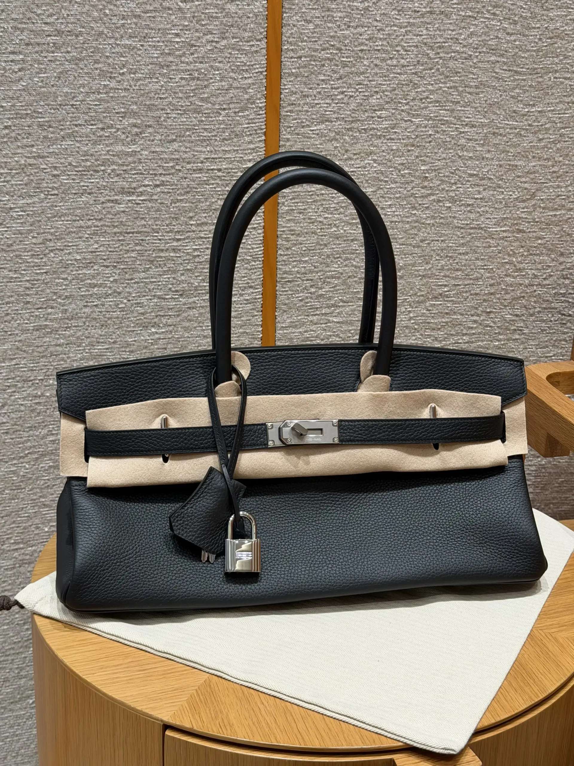 Front overview of a black Shoulder Birkin 42 replica with long handles and silver-tone hardware