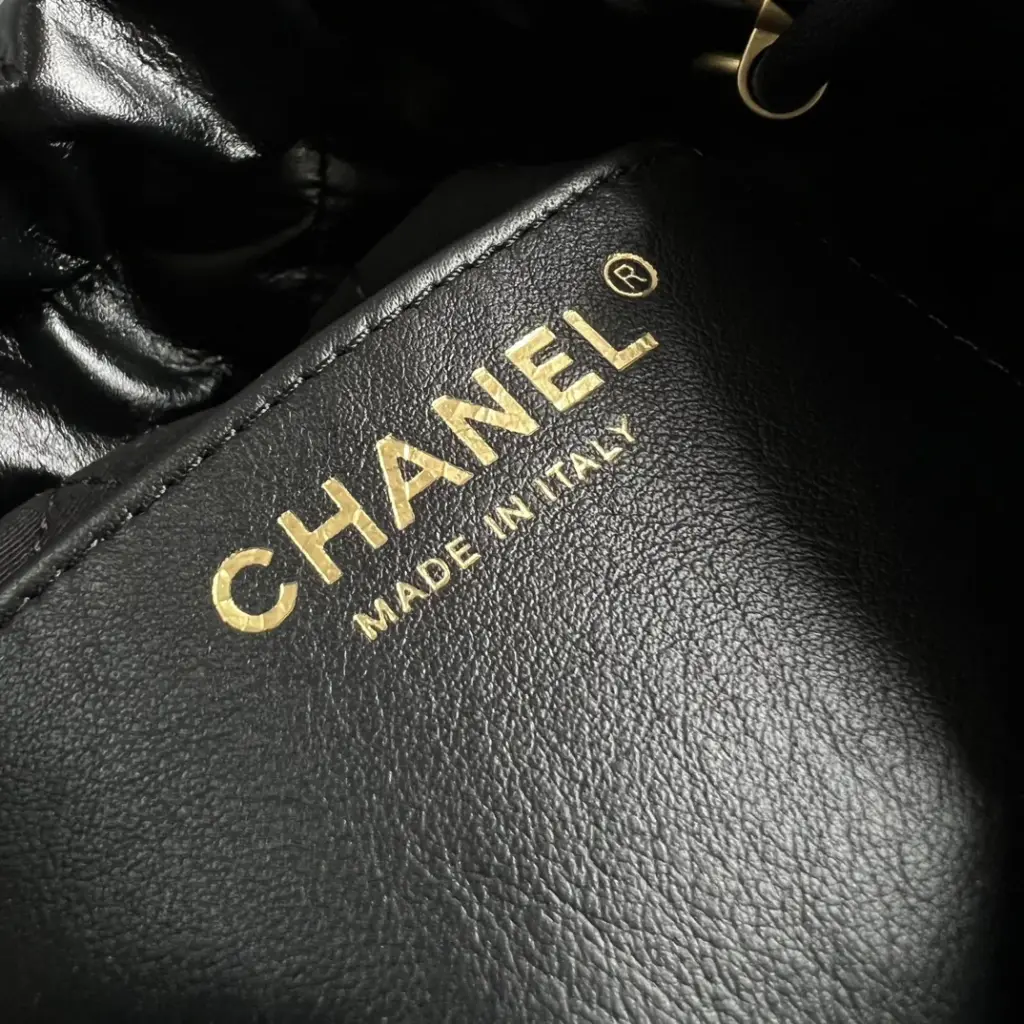 Open top view into the black Chanel 22 Mini-style bag