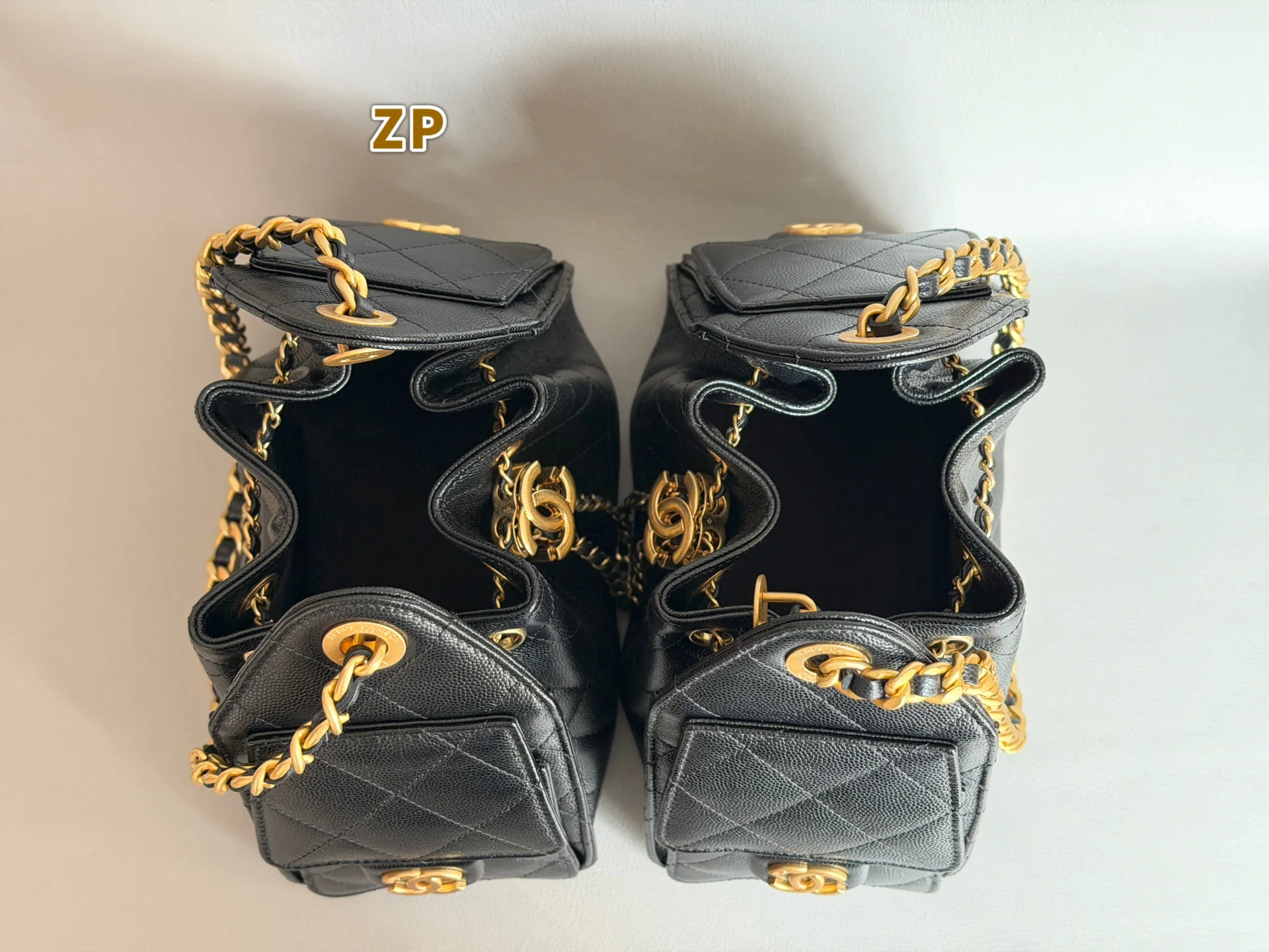Authentic-left and replica-right Chanel 25 Mini open-top comparison