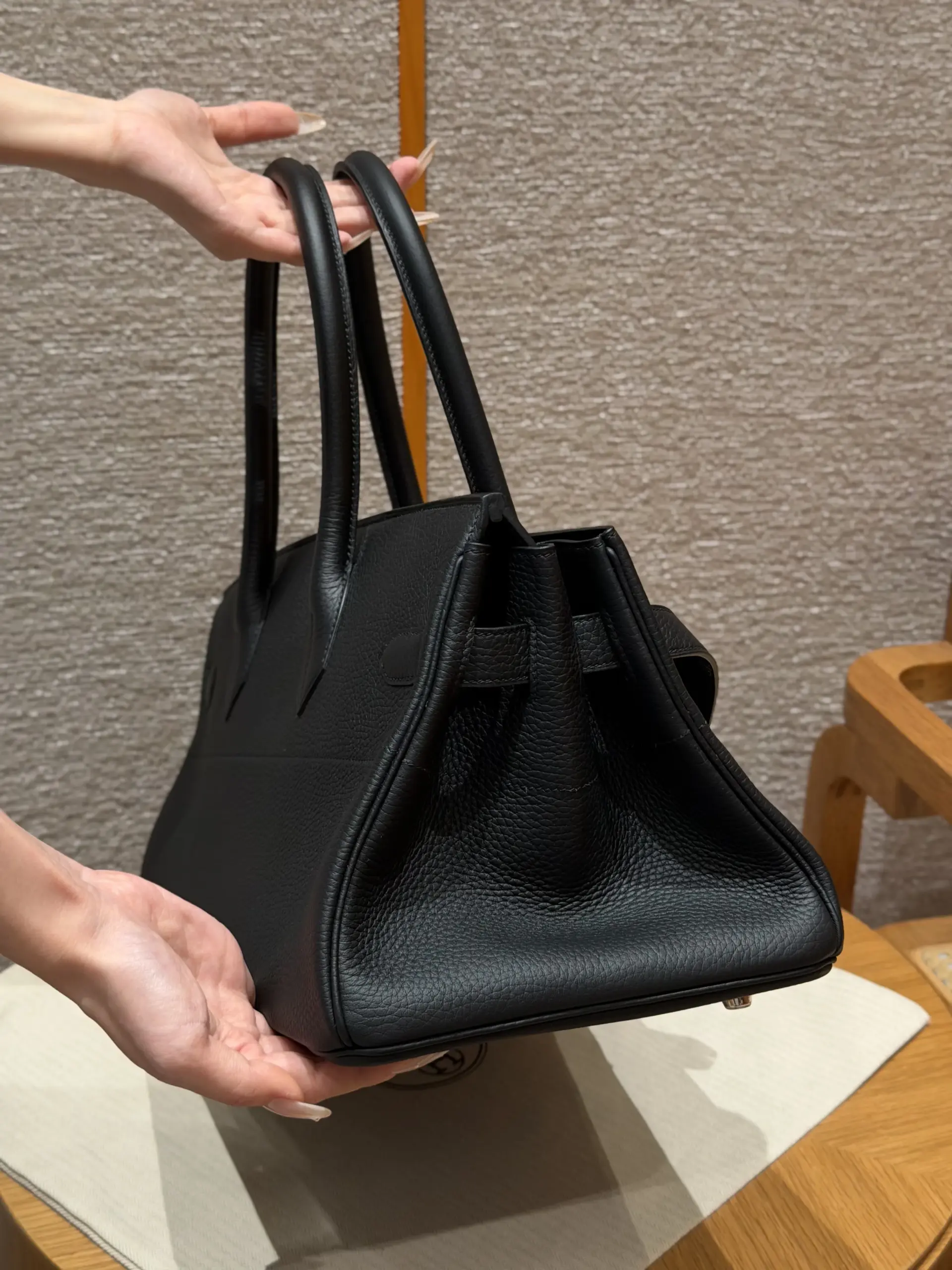 Open side view of a black Shoulder Birkin 42 replica showing the deep body and long handles