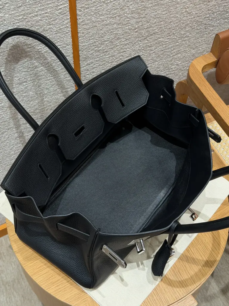 Open interior of a black Shoulder Birkin 42 replica showing the wide central compartment