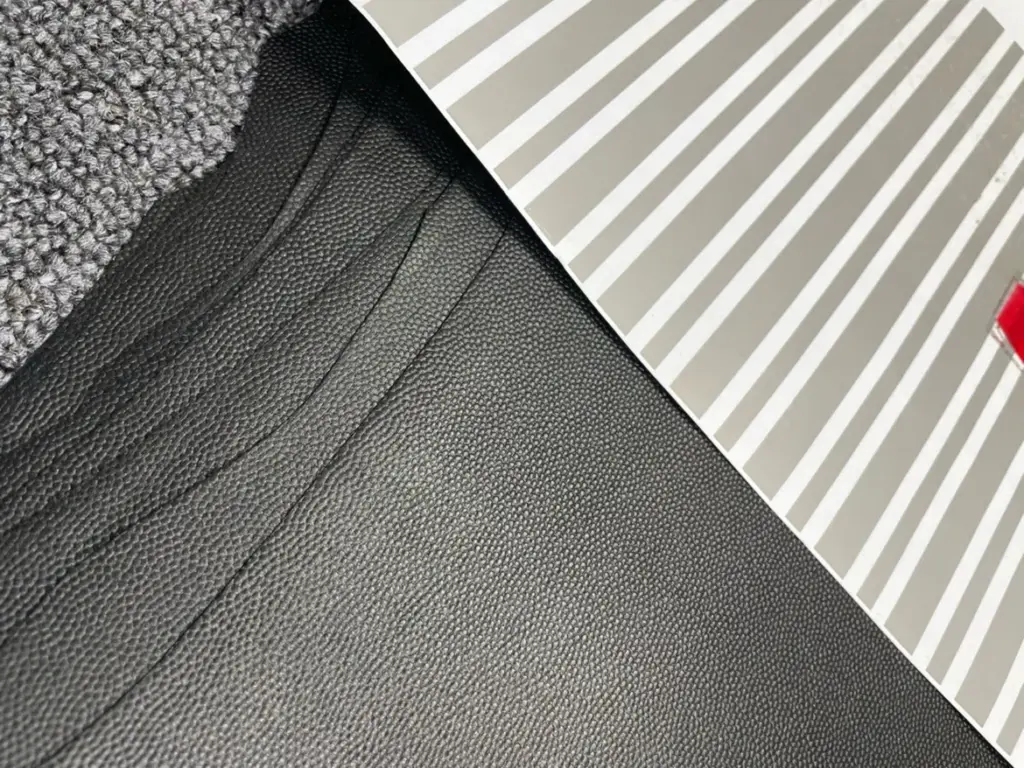 Flat black caviar-style leather grain reference