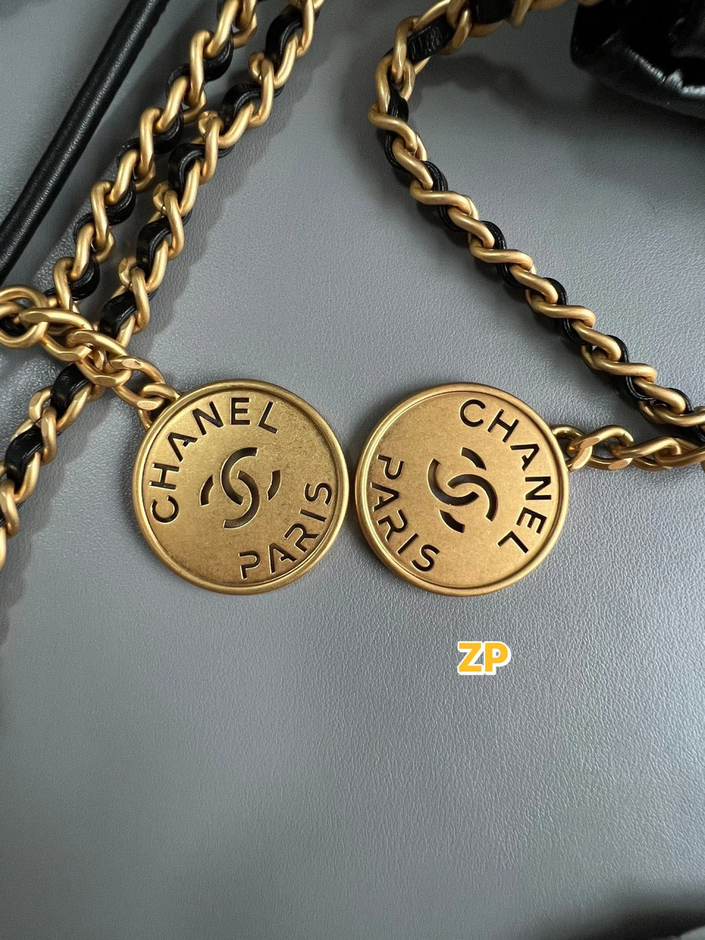 Authentic reference and reviewed round gold-tone medallions for Chanel 22-style bags