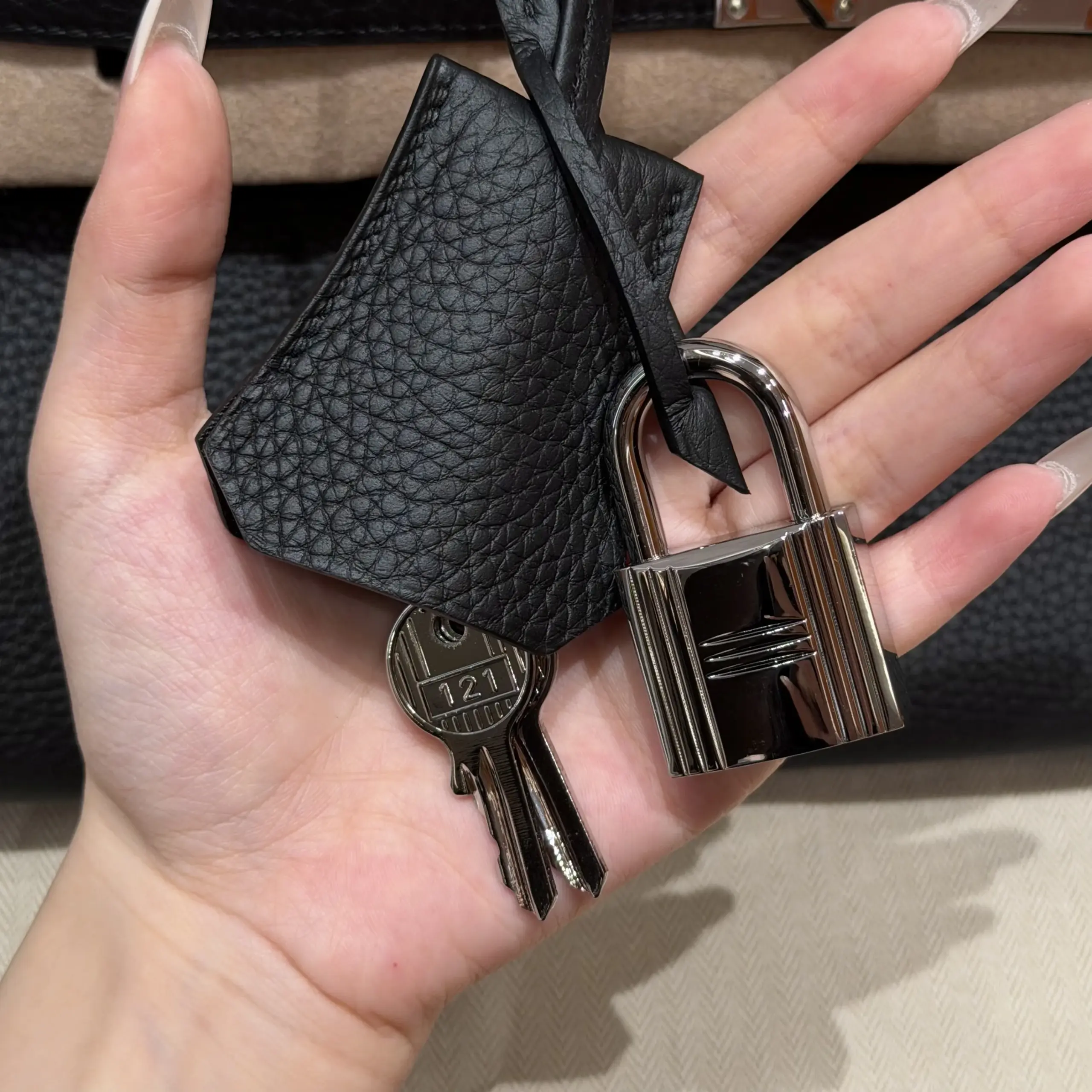 Silver-tone lock and keys with a black leather clochette for a Shoulder Birkin 42 replica