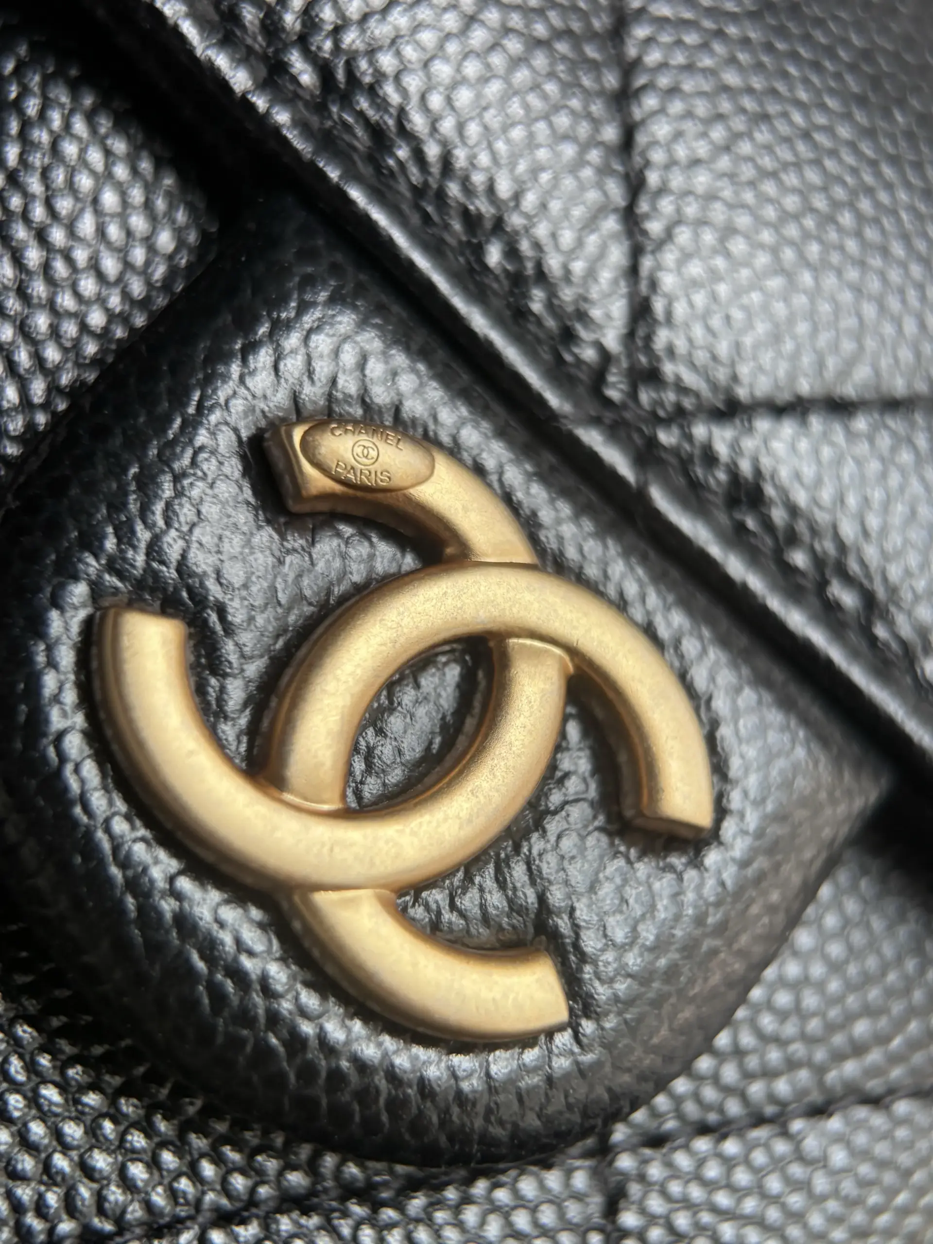 Macro of a folded black caviar gusset corner and stitching