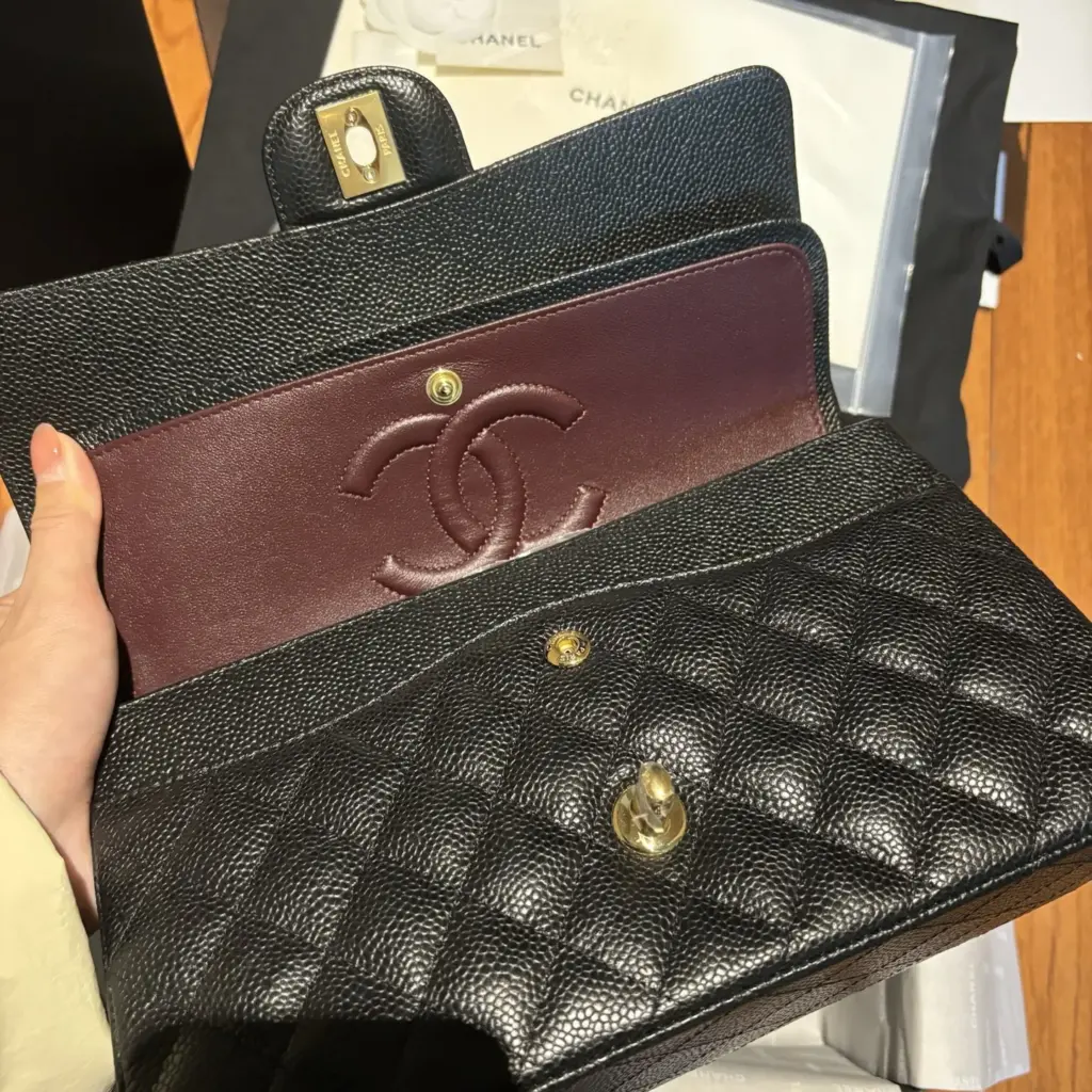 Handheld open double flap with burgundy interior on a CF25 replica