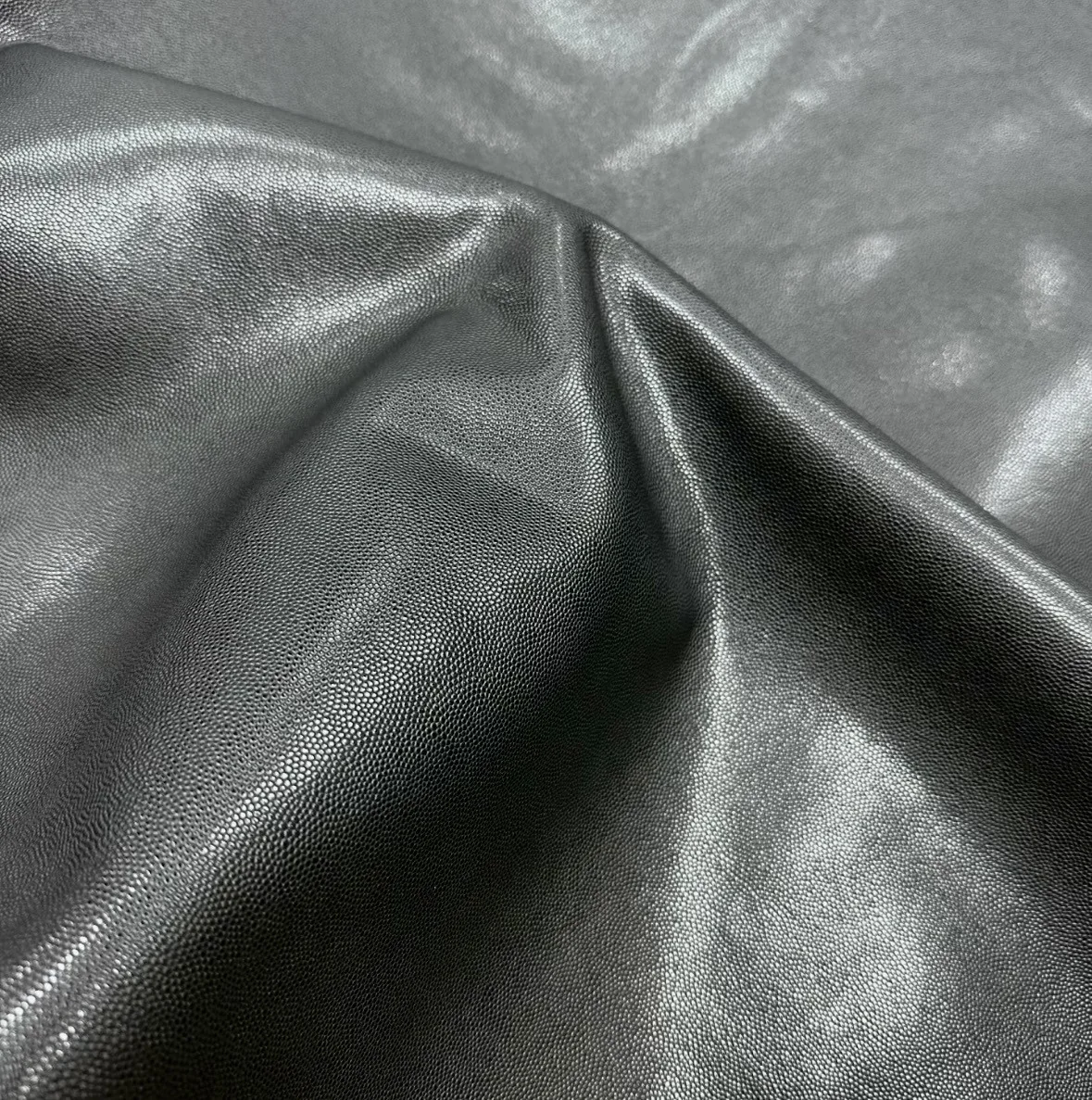 Black fine-grain leather drape and flexibility reference