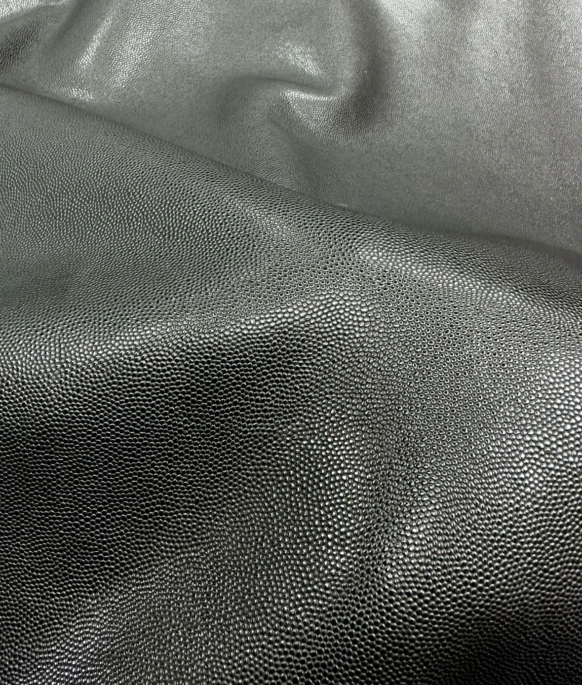 Wide texture reference of black fine caviar-style leather