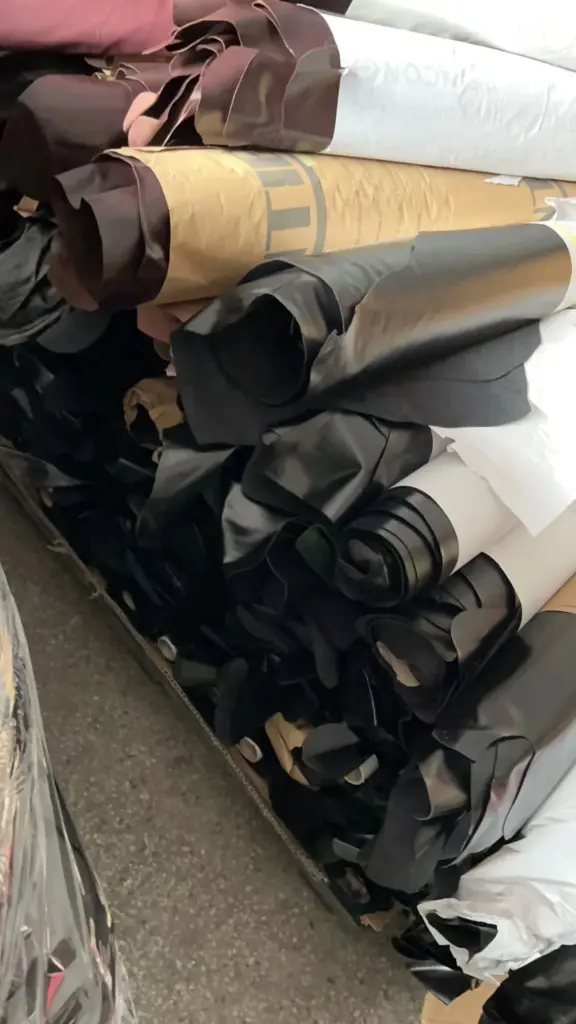 Material-source record showing black leather rolls and offcuts used for the reviewed bag