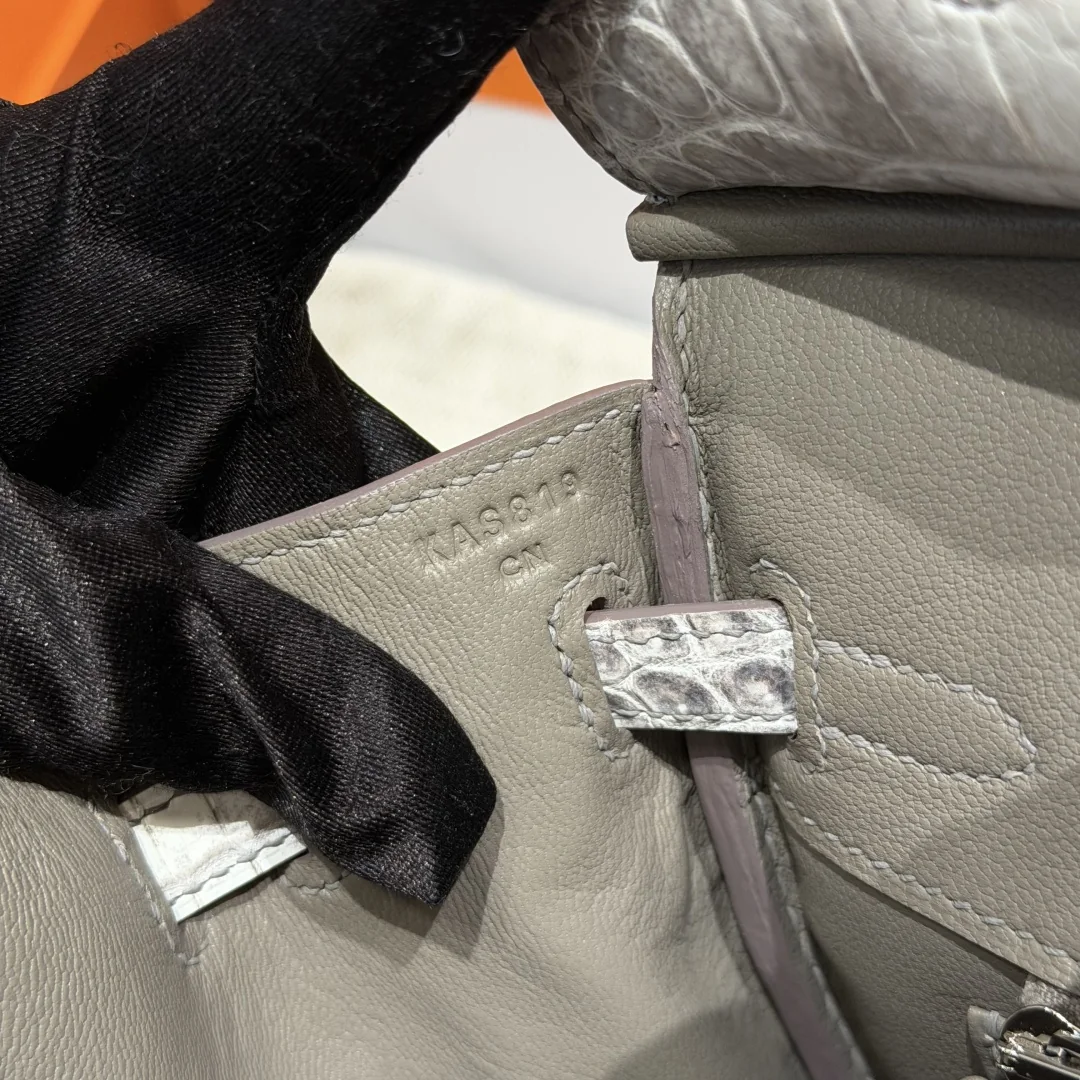 Interior close-up showing grey lining stitches and an impressed code