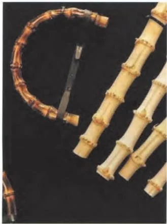 Several curved bamboo handle sections in different tones
