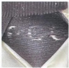 Reverse of a Gucci dust bag woven label showing backing yarns