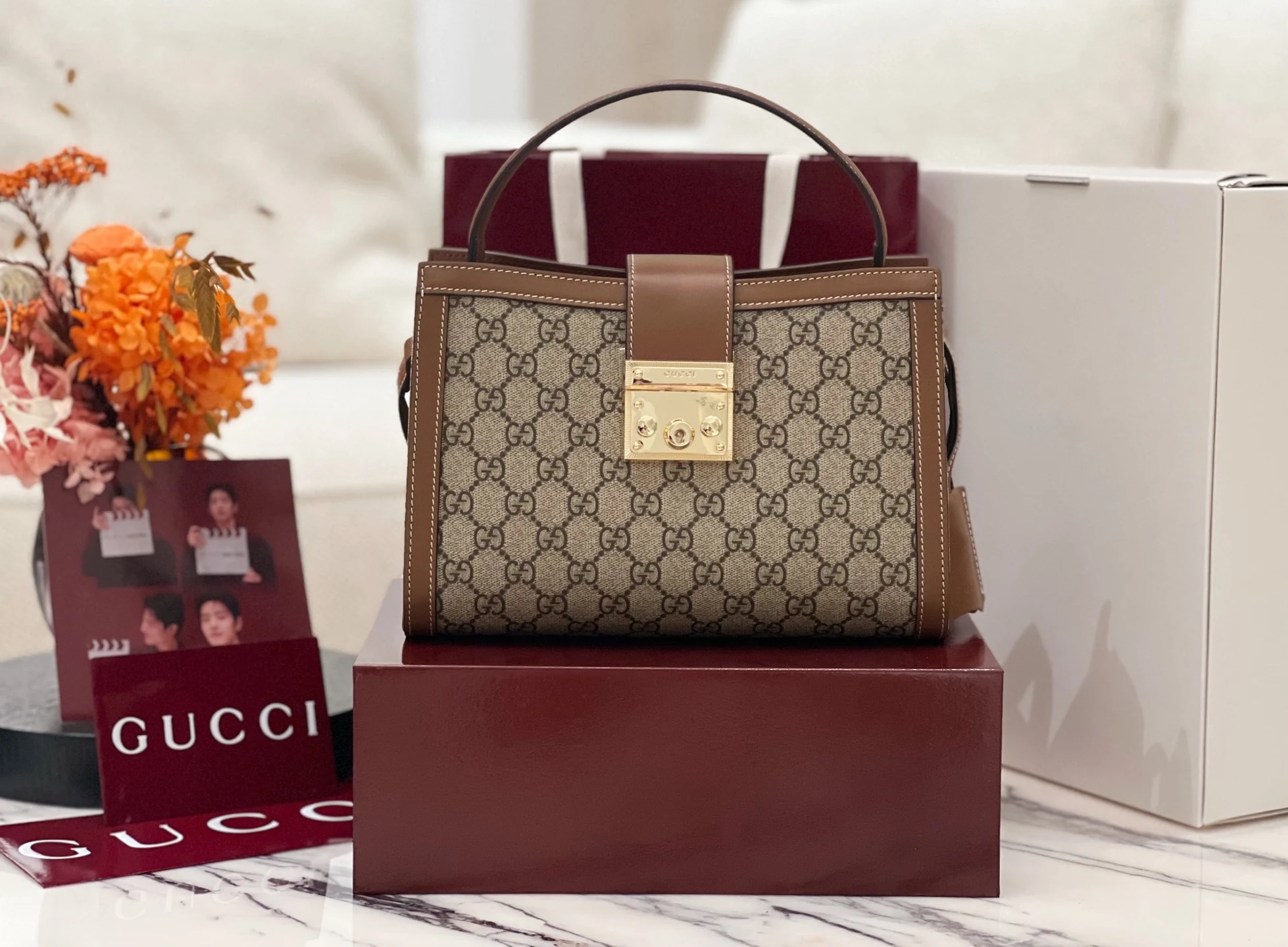 Gucci Padlock 838992 with brown framing and a square gold lock