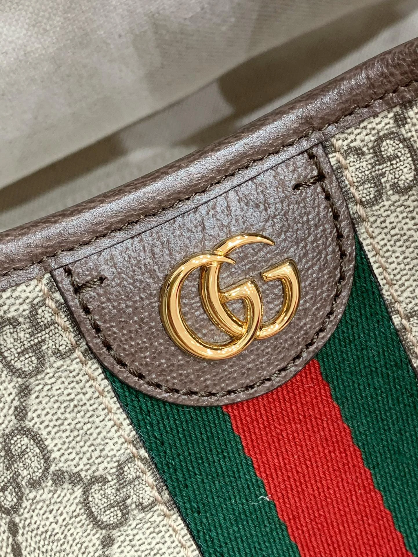 Gold-tone Double G above a green-red-green woven stripe