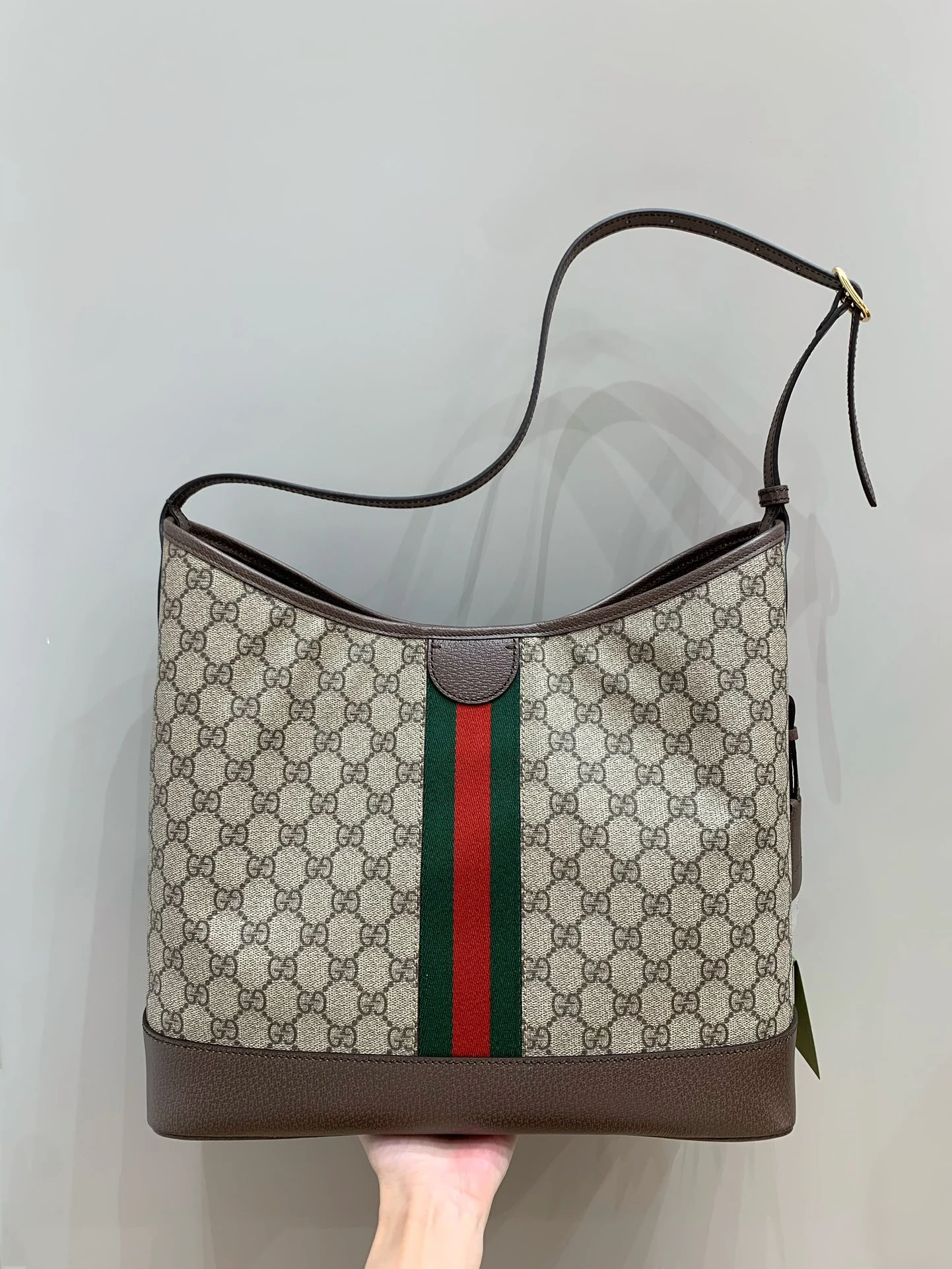 Reverse monogram panel with a central Web stripe and plain brown tab